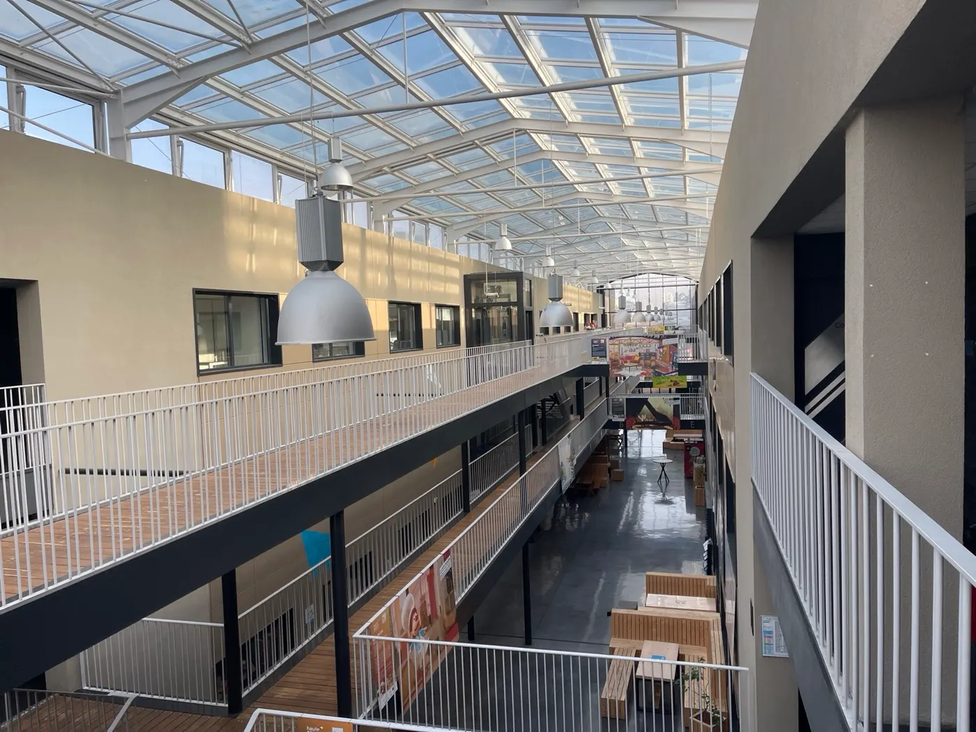 The glass roof and inner walkways of Les Papeteries
