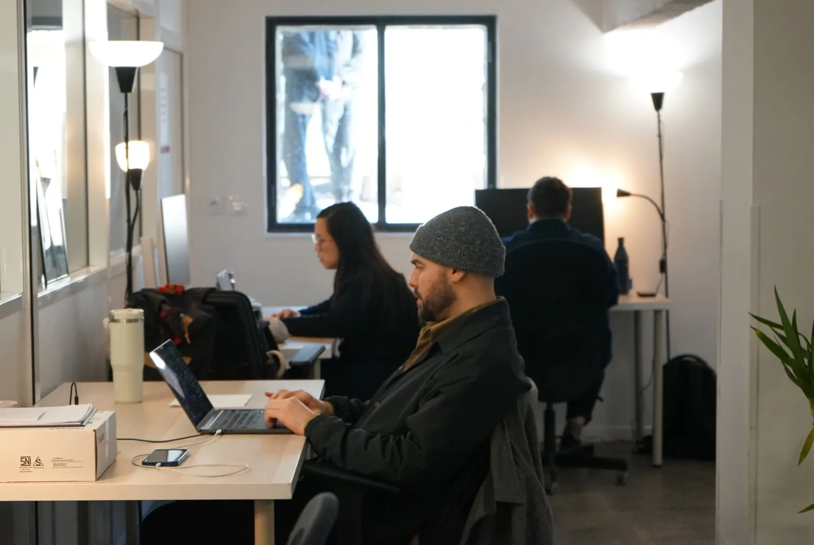 Craftspeople at work in a Dev-id workshop
