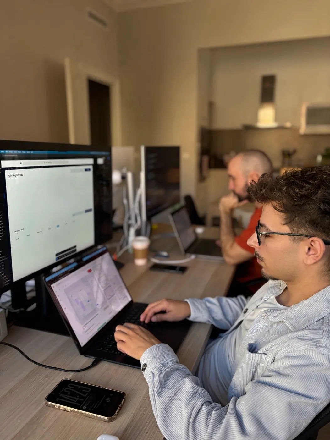 A developer at work on a laptop at the Toulouse workshop